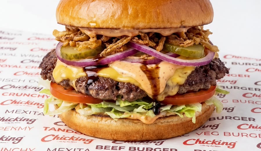 A Chicking smash burger with cheese and pickles