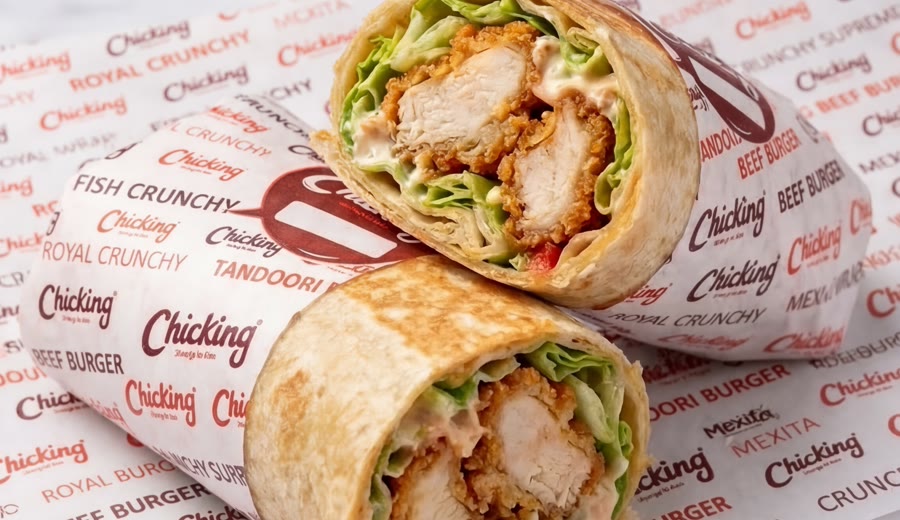 A Royal wrap cut open, showing crispy chicken and salad